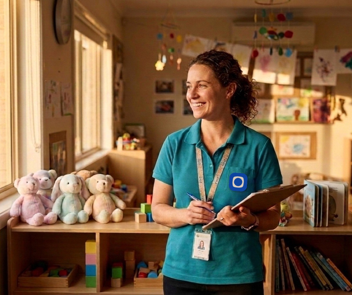 Childcare educator holding a clipboard in a bright nursery room